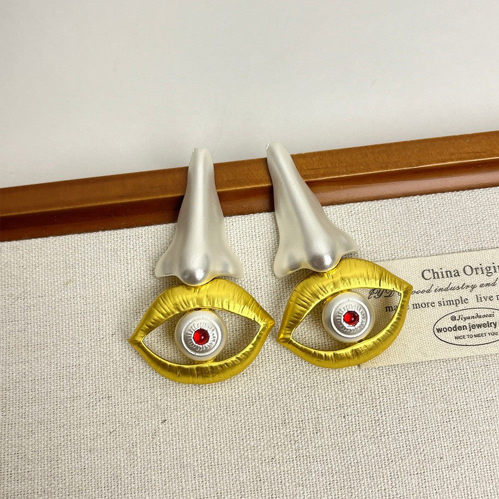 Asymmetric Nose and Eye Drop Earrings