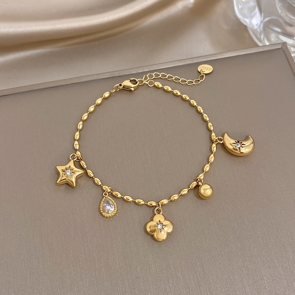 18k Charm Bracelet with Star and Flower Pendants