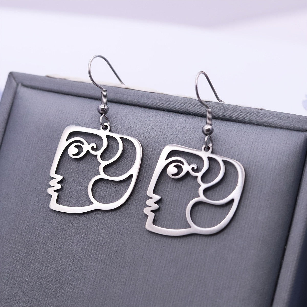 Abstract Face Outline Drop Earrings